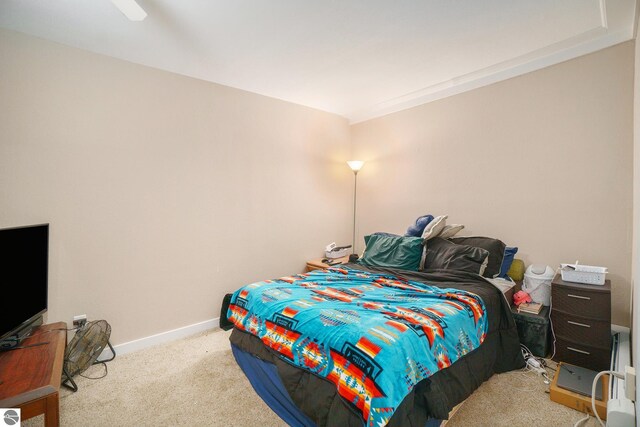 carpeted bedroom featuring baseboards