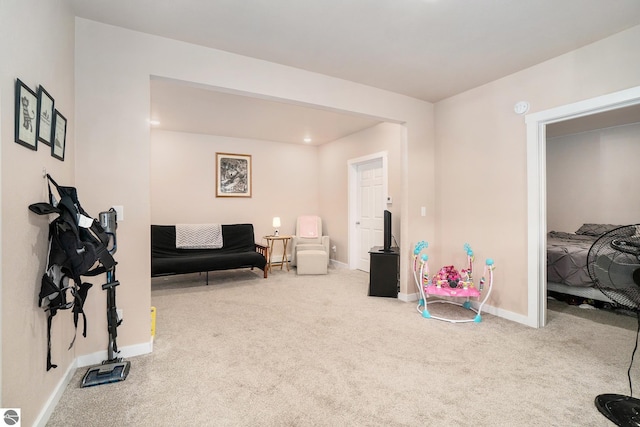 interior space with carpet floors and baseboards