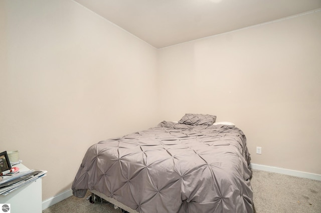 carpeted bedroom with baseboards