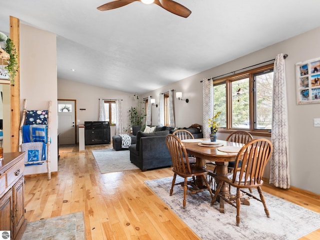 431 E Bittner Ave, Reed City, MI 49618 - dining space featuring vaulted ceiling, a ceiling fan, and light wood-type flooring