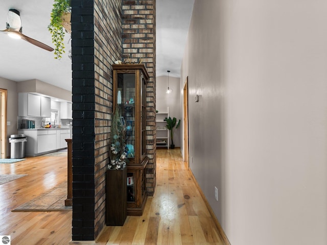 431 E Bittner Ave, Reed City, MI 49618 - corridor with baseboards and light wood-type flooring