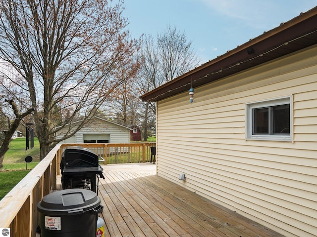 431 E Bittner Ave, Reed City, MI 49618 - wooden terrace featuring a yard and an outdoor structure