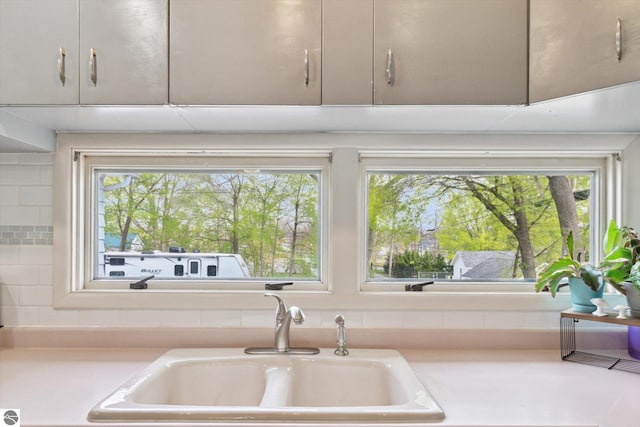 422 W Center, Alma, MI 48801 - details with light countertops and a sink