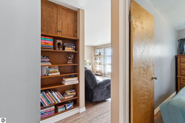 422 W Center, Alma, MI 48801 - hall featuring baseboards and light wood-style flooring