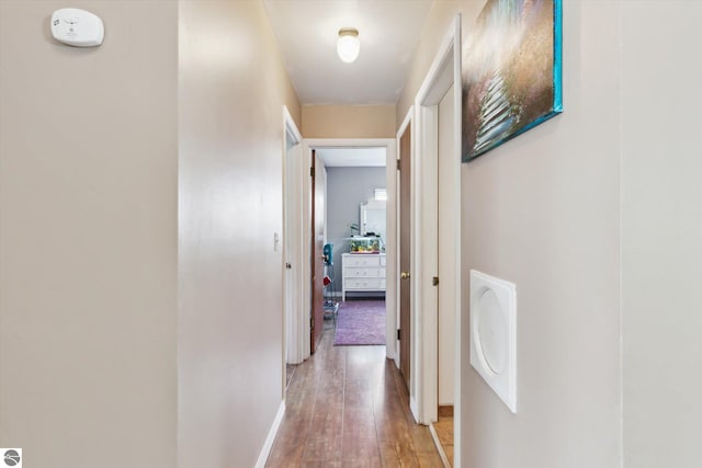 422 W Center, Alma, MI 48801 - corridor featuring light wood-type flooring and baseboards