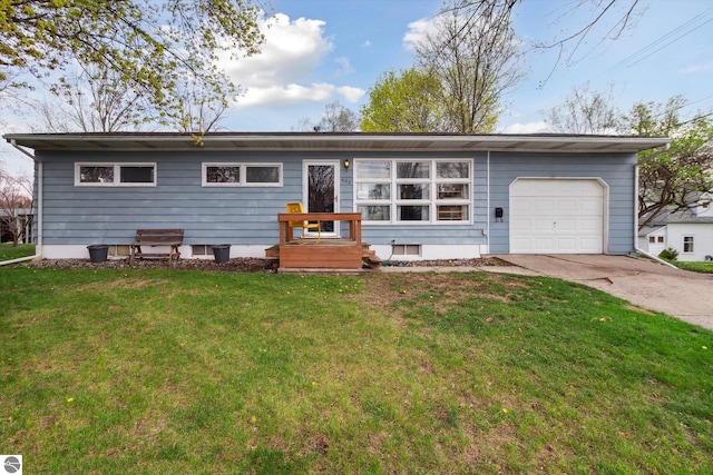 422 W Center, Alma, MI 48801 - single story home with concrete driveway, a front yard, and a garage