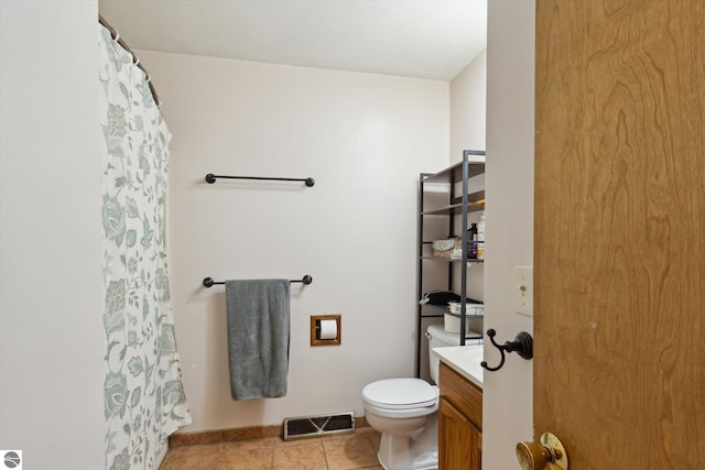 422 W Center, Alma, MI 48801 - bathroom featuring visible vents, vanity, toilet, tile patterned floors, and a shower with curtain