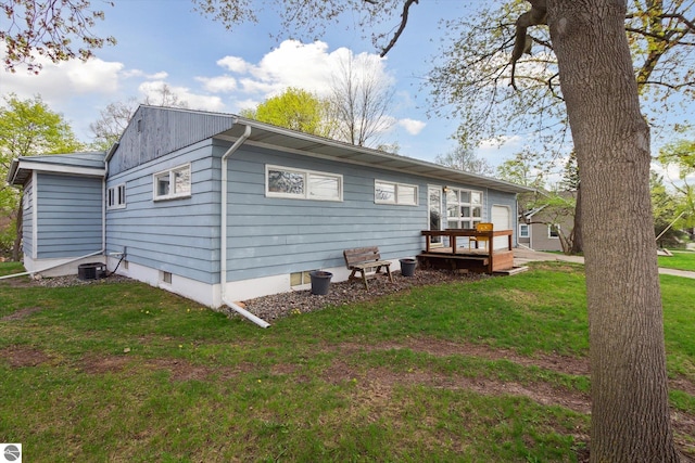 422 W Center, Alma, MI 48801 - rear view of house with a yard and a deck