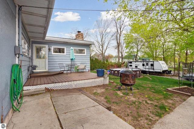 422 W Center, Alma, MI 48801 - view of yard with a trampoline and a deck
