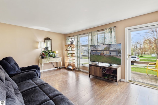 422 W Center, Alma, MI 48801 - living room featuring baseboards and wood finished floors