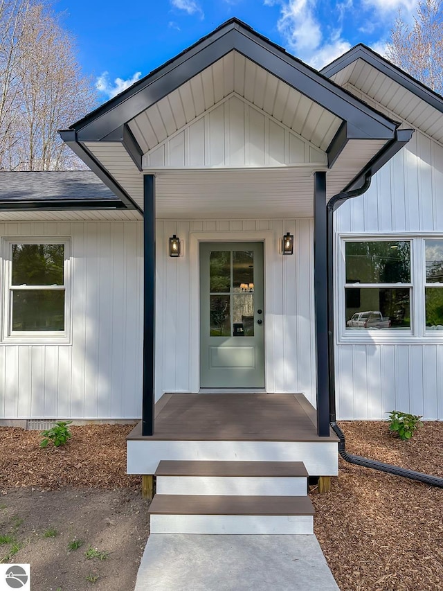 doorway to property with board and batten siding