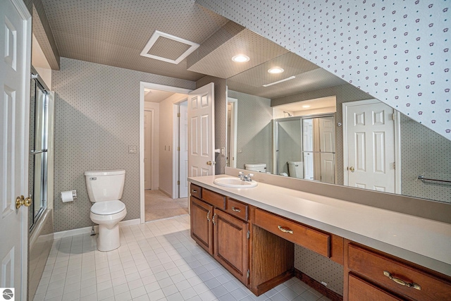 full bathroom with tile patterned floors, wallpapered walls, and toilet