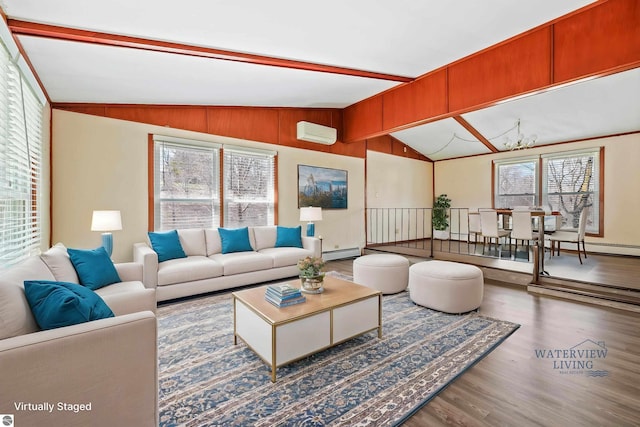 living room with vaulted ceiling with beams, a baseboard radiator, wood finished floors, and a healthy amount of sunlight