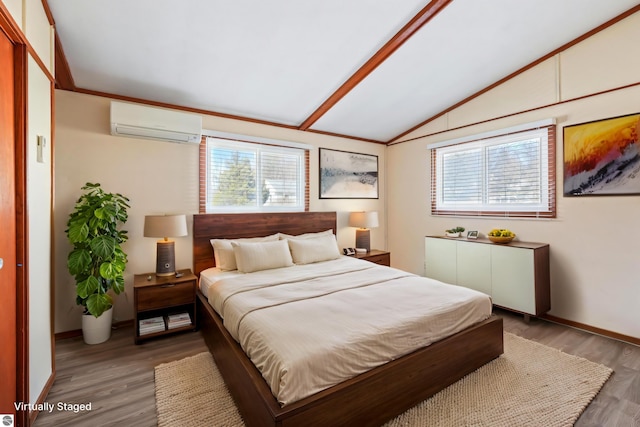 bedroom with wood finished floors, baseboards, a wall mounted air conditioner, and lofted ceiling