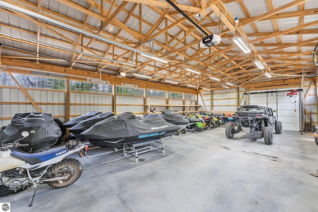 garage with metal wall and a garage door opener