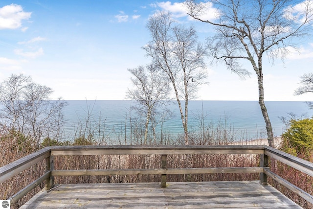 wooden deck with a water view