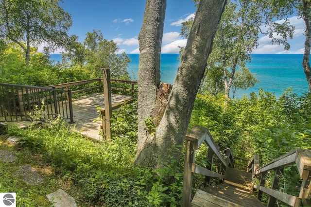 exterior space with a deck with water view