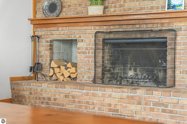 room details featuring a brick fireplace