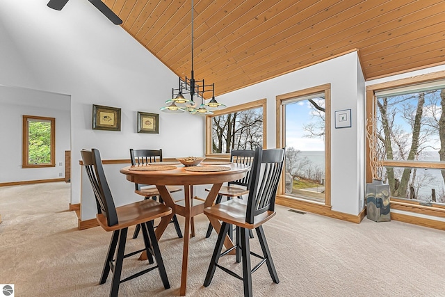 dining area featuring a notable chandelier, light colored carpet, high vaulted ceiling, baseboards, and wooden ceiling