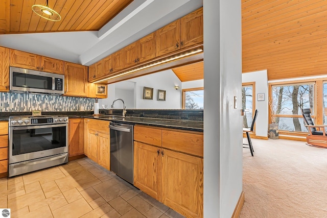 kitchen featuring plenty of natural light, a sink, wooden ceiling, and stainless steel appliances