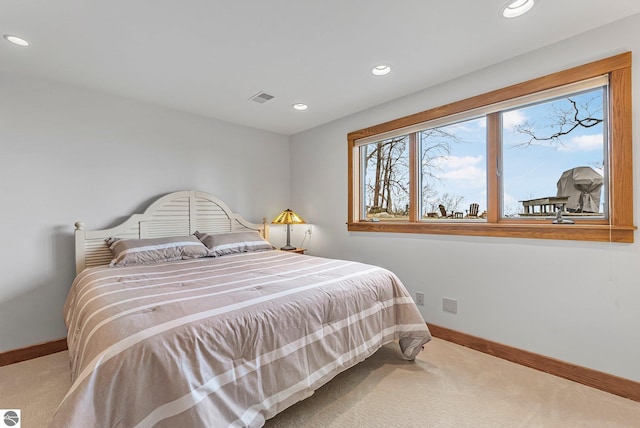 carpeted bedroom with recessed lighting, baseboards, and visible vents