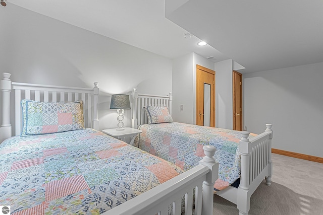 bedroom featuring baseboards and light carpet