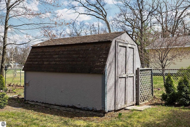 view of shed with fence
