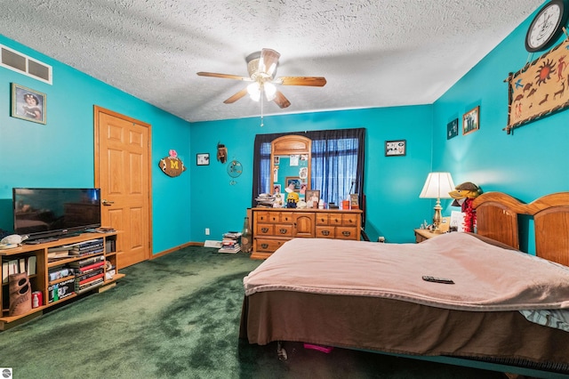 bedroom with visible vents, carpet flooring, a textured ceiling, and a ceiling fan