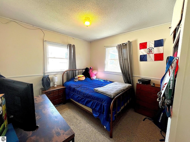 carpeted bedroom with a textured ceiling