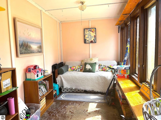 bedroom with unfinished concrete flooring