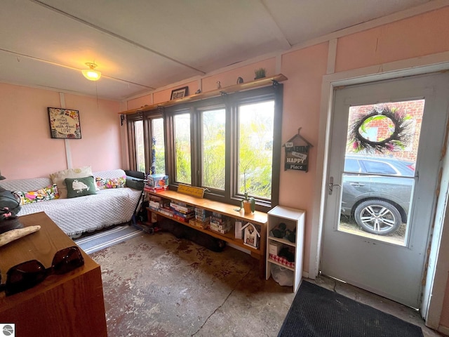 bedroom featuring concrete floors