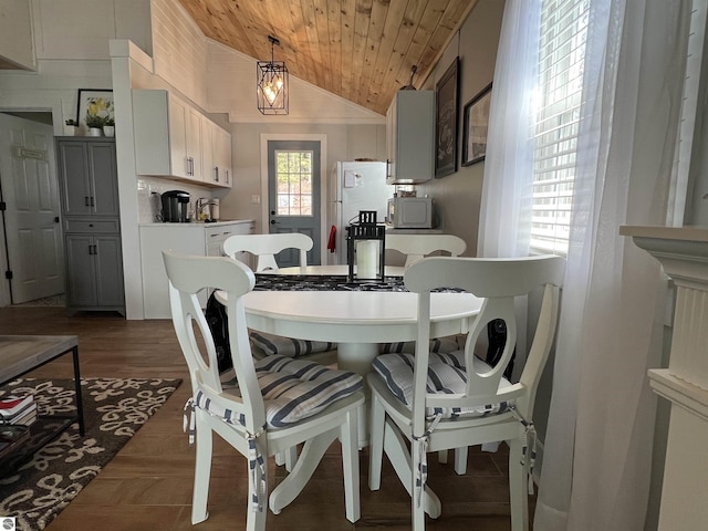 dining space with wood ceiling and lofted ceiling