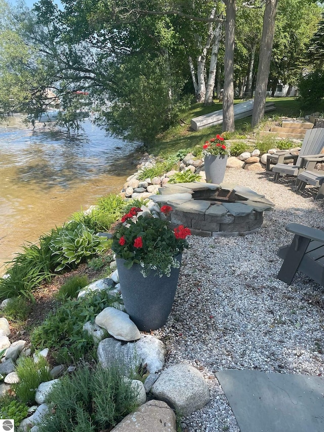view of yard with a fire pit
