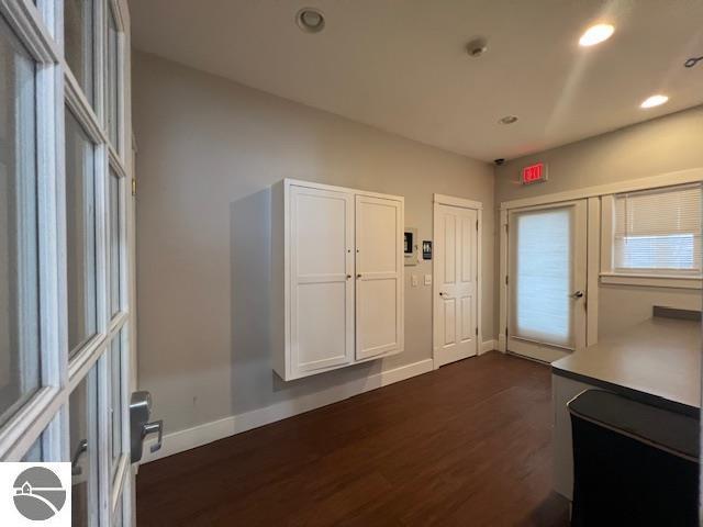 300 S Grand Ave, Leland, MI 49654 - doorway with recessed lighting, baseboards, and dark wood-style floors