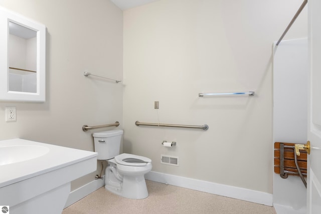 300 S Grand Ave, Leland, MI 49654 - bathroom featuring baseboards, vanity, toilet, and visible vents