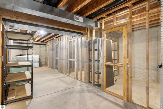 300 S Grand Ave, Leland, MI 49654 - unfinished basement featuring visible vents