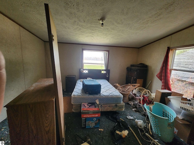 6889 Carpenter Rd, Whittemore, MI 48770 - bedroom featuring ornamental molding and a textured ceiling