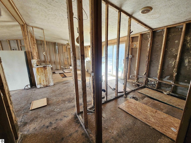 6889 Carpenter Rd, Whittemore, MI 48770 - misc room featuring a textured ceiling
