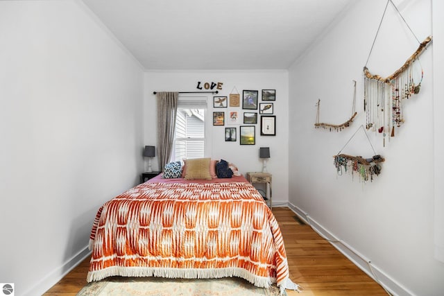 917 Lincoln St, Traverse City, MI 49686 - bedroom with baseboards and wood finished floors