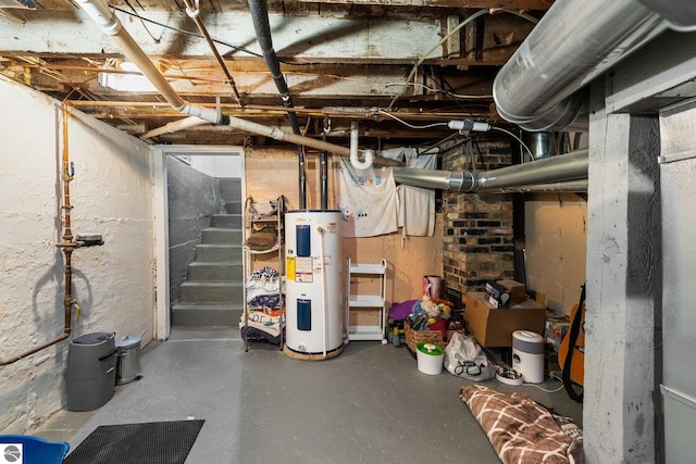 917 Lincoln St, Traverse City, MI 49686 - unfinished basement with stairway and electric water heater