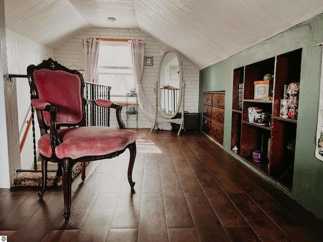sitting room featuring vaulted ceiling and hardwood / wood-style flooring