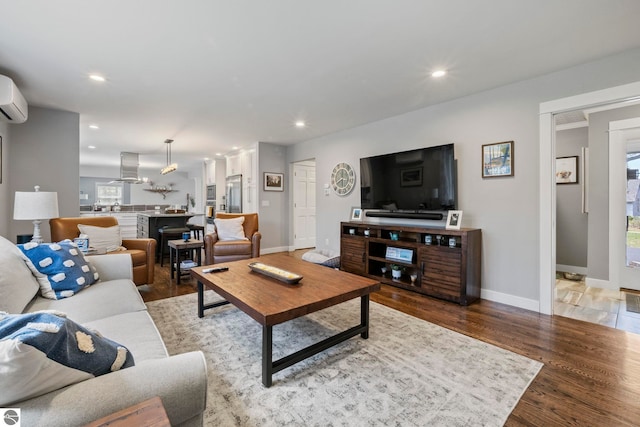 9086 N Tottenham Dr, Traverse City, MI 49685 - living room featuring light wood-style floors, recessed lighting, and baseboards