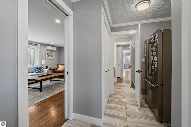 9086 N Tottenham Dr, Traverse City, MI 49685 - hall featuring light wood-style floors, baseboards, crown molding, and an AC wall unit