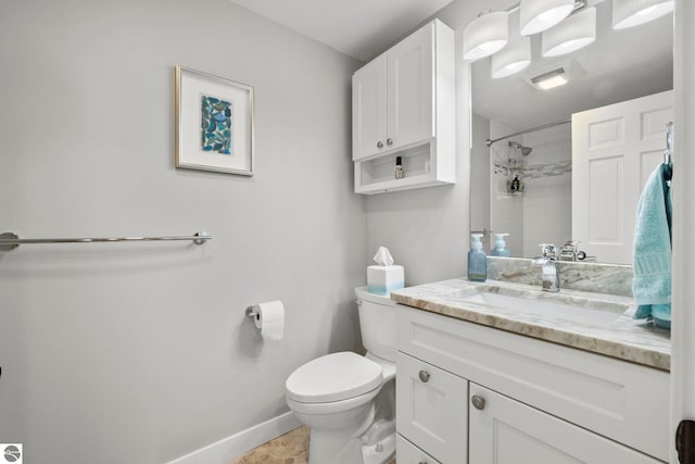 9086 N Tottenham Dr, Traverse City, MI 49685 - full bathroom featuring baseboards, vanity, toilet, and tiled shower