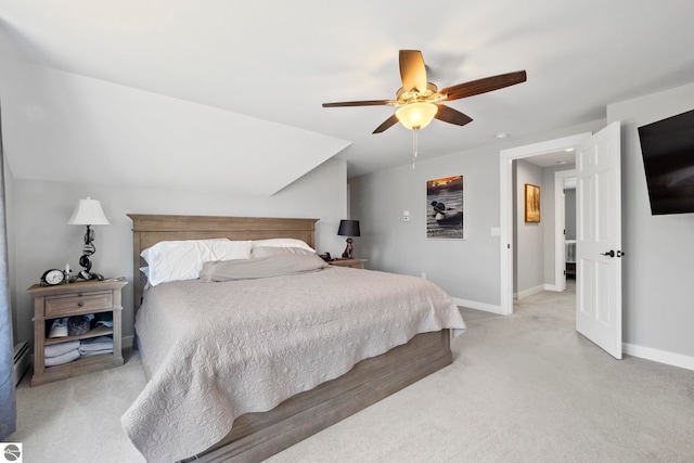 9086 N Tottenham Dr, Traverse City, MI 49685 - bedroom with a ceiling fan, baseboards, light colored carpet, and a baseboard radiator