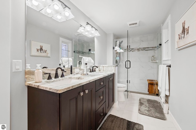 9086 N Tottenham Dr, Traverse City, MI 49685 - full bath with double vanity, a sink, toilet, and a shower stall