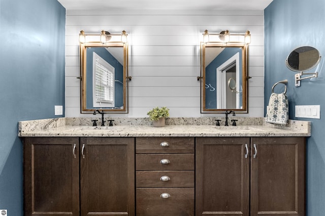bathroom featuring double vanity and a sink