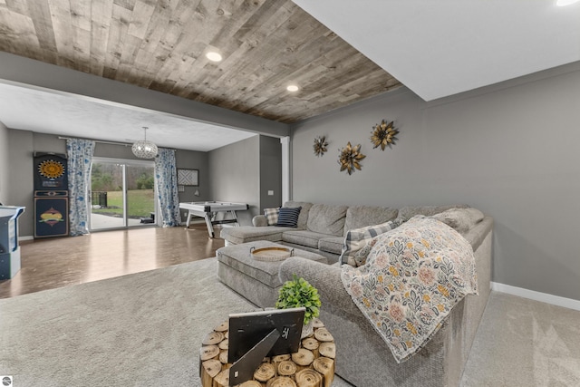 living area featuring an inviting chandelier, wood finished floors, baseboards, recessed lighting, and wooden ceiling