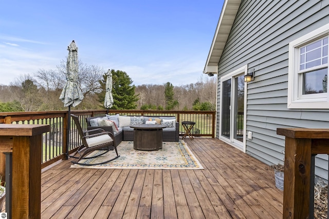 wooden terrace featuring an outdoor living space