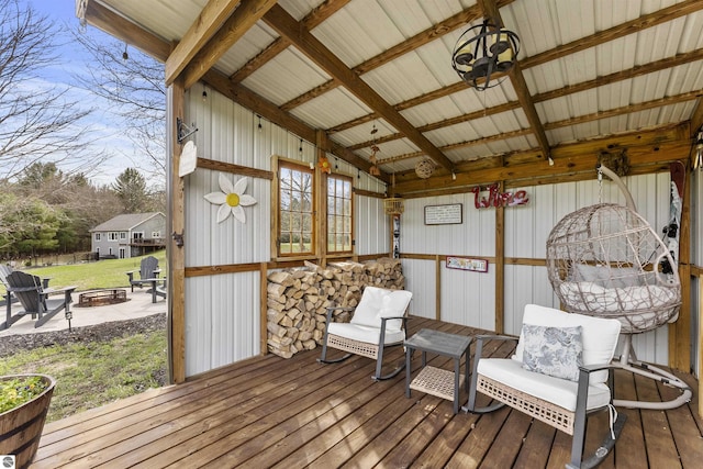wooden deck with a fire pit